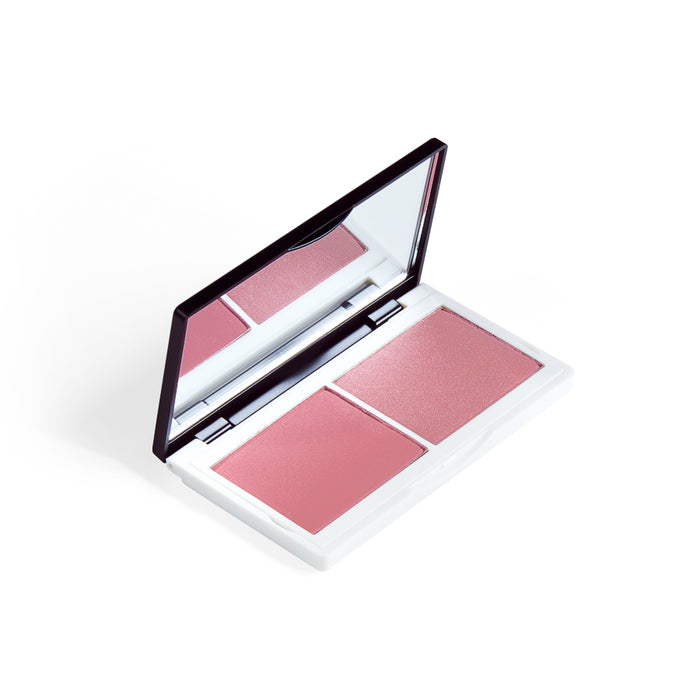 An open makeup compact with a mirror, containing two shades of pink blush, one matte and one shimmery, in a white case.