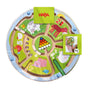 The HABA Number Maze Magnetic Game for ages 2+ features a round wooden board with cow, horse, chicken, and pig illustrations, numbered sections, colorful center balls, and comes in packaging showing the “HABA” logo and a child playing.