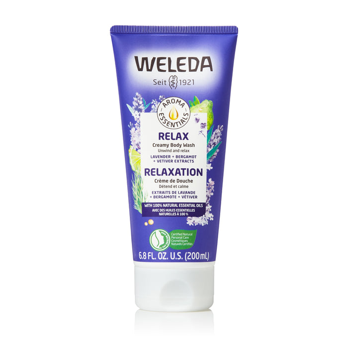 A purple tube of Weleda Aroma Essentials Relax Creamy Body Wash, featuring lavender, bergamot, and vetiver. The label displays lavender flowers and leaves, with product details in English, French, and German. 200ml size.