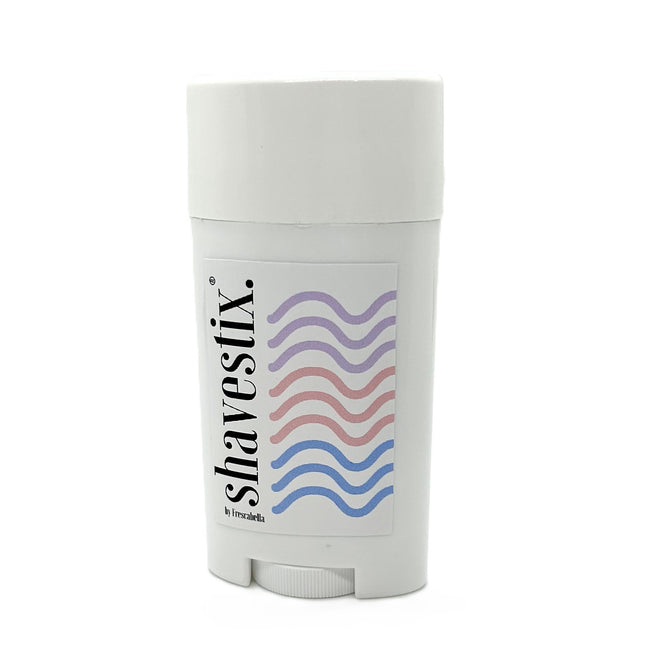 The Shavestix Solid Shave Stick container is white, adorned with a vibrant purple, pink, and blue wavy line pattern on the front, and is enhanced with a Hydrating Veil for ultimate smoothness.