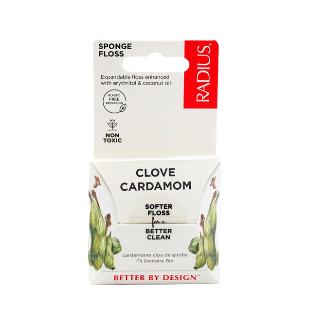 A package of Radius Vegan Floss in Clove Cardamom flavor highlights softer, organic floss for a better clean, featuring a plastic-free design infused with erythritol and coconut oil, along with images of clove and cardamom.