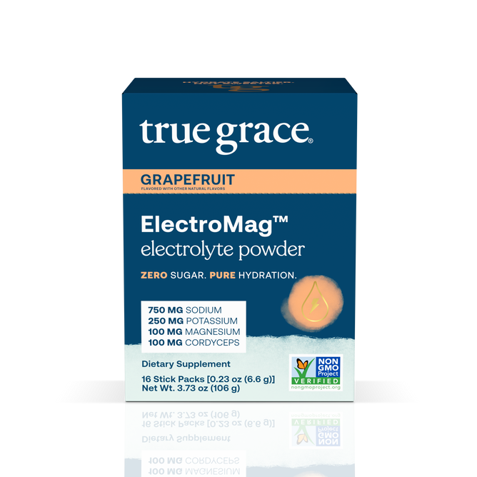 A box of True Grace ElectroMag electrolyte powder, grapefruit flavor. The blue and orange box highlights key ingredients: sodium, potassium, magnesium, and cordyceps. The product is non-GMO and sugar-free.