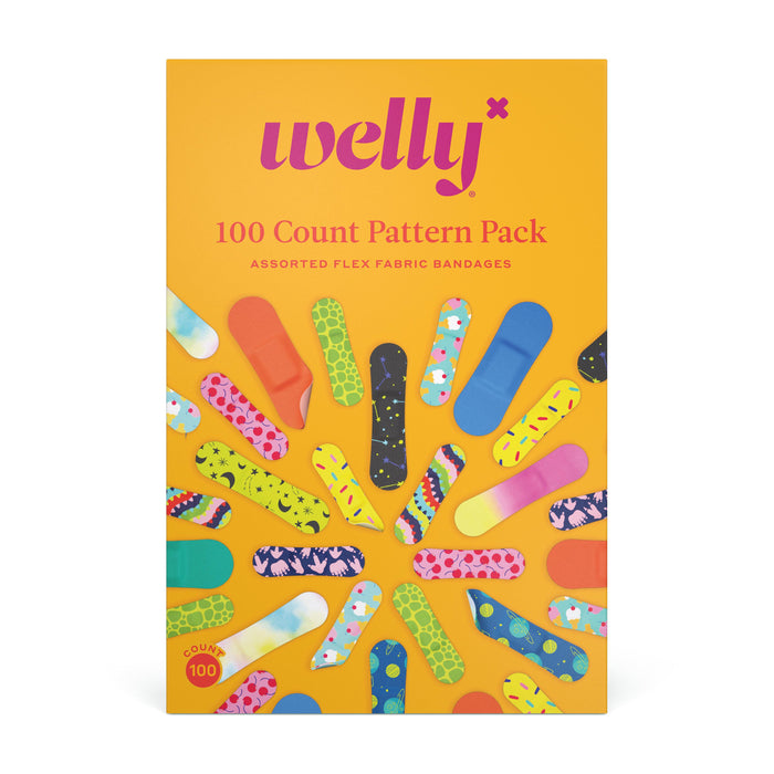 Bright yellow box of Welly 100 Count Pattern Pack flex fabric bandages, featuring colorful, patterned bandages arranged in a circle on the front. Text describes assorted designs inside the pack.