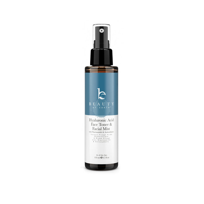 A bottle of Beauty by Earth Hyaluronic Acid Face Toner & Facial Mist with a blue and white label and a black spray cap, shown on a white background.