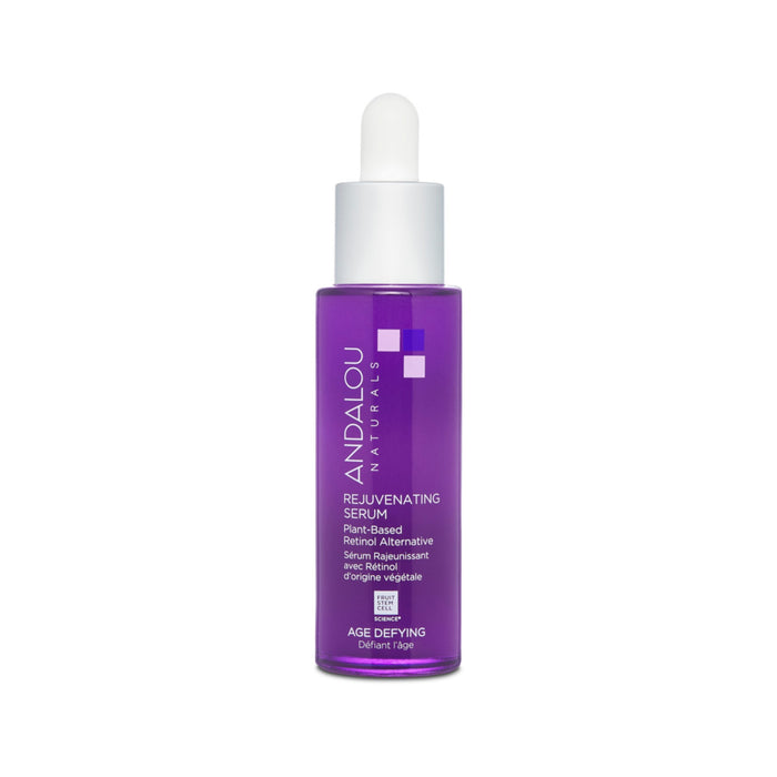 A purple bottle of Andalou Naturals Age Defying Rejuvenating Retinol Alternative Serum with a dropper top stands against a white background, labeled plant-based and featuring bakuchiol for anti-aging benefits as a retinol alternative.