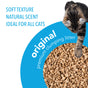 A cat steps onto a circle of okocat Original Clumping Wood Cat Litter. Text reads: Soft texture, natural scent, original premium odor control—ideal for all cats.