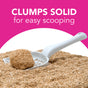A white scoop holds a solid clump of okocat Super Soft Clumping Wood Cat Litter, surrounded by loose litter, with the text CLUMPS SOLID for easy scooping on a pink and white background.