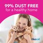 A smiling girl holds two orange kittens with the text 99% Dust Free for a Healthy Home on a pink background. The okocat logo in the bottom right highlights that Super Soft Clumping Wood Cat Litter controls odor with natural wood fiber.