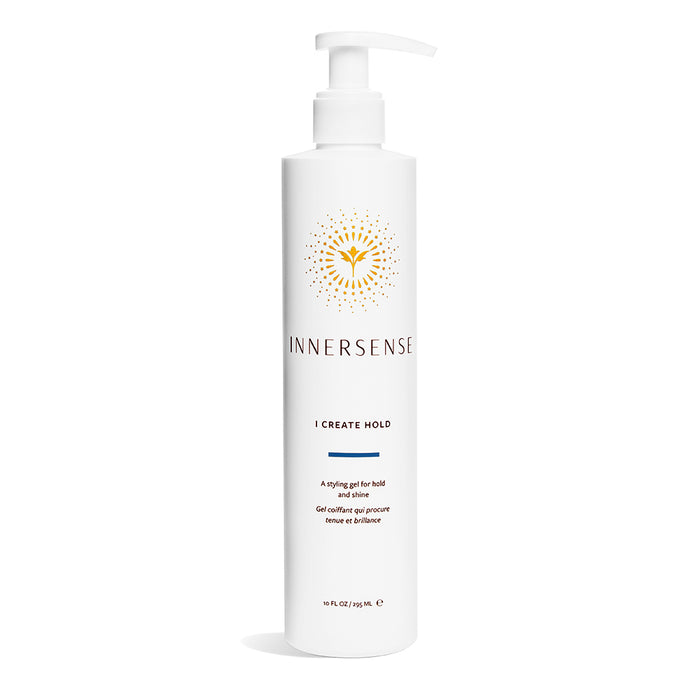 A white pump bottle labeled Innersense I Create Hold with a gold floral logo, blue accent line, and text describing it as a styling gel for hold and shine. The bottle contains 10 fl oz (295 ml).