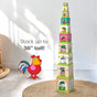 HABA Stacking & Nesting Cubes - On the Farm shown as ten square stacking cubes with farm animal illustrations and numbers, arranged in a tower next to a red rooster graphic and the text Stack up to 36 tall!.