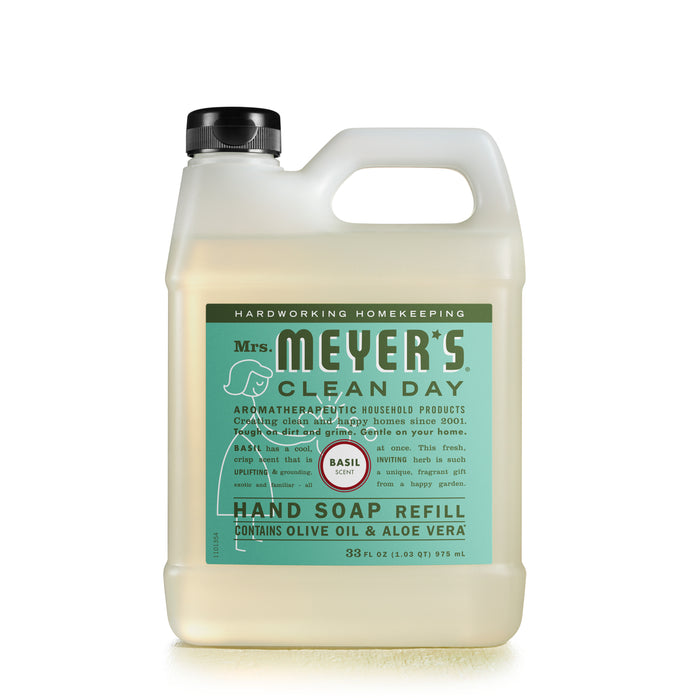 A 33 fl oz plastic refill bottle of Mrs. Meyers Clean Day hand soap in basil scent, featuring a black cap and a green label with white and dark green text describing product details and ingredients.