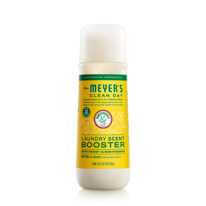 The Laundry Scent Booster by Mrs. Meyers is shown in a cylindrical bottle with a white cap and a yellow label for the lemon verbena scent. Its ideal for 18 loads, featuring natural ingredients and essential oils. Every wash includes an uplifting hint of Compassion Flower essence.