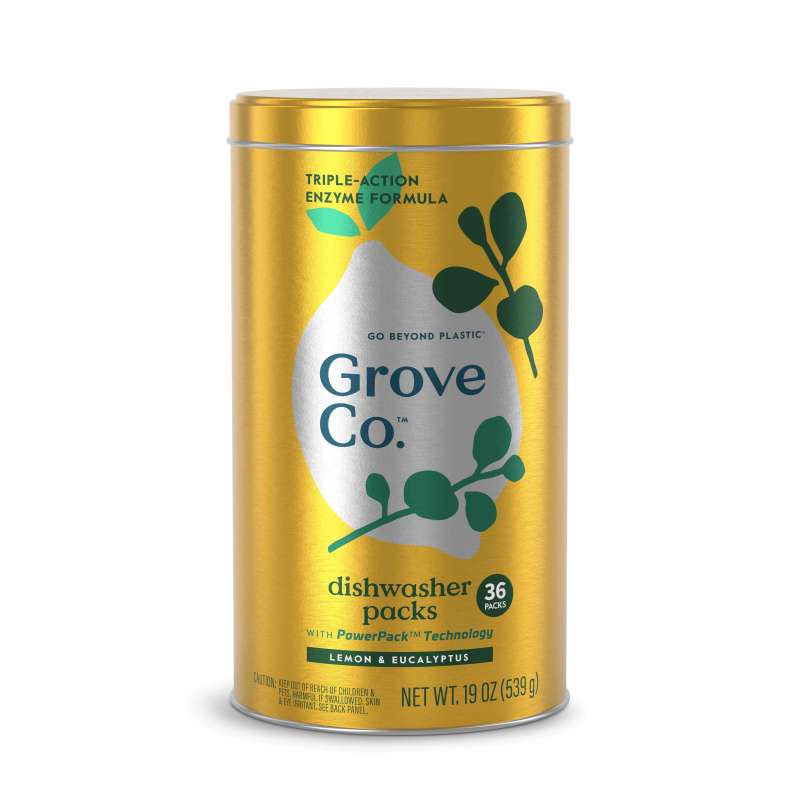Gold cylindrical metal container labeled Grove Co. displays dishwasher detergent packs with a leaf design. It features the text Triple-Action Enzyme Formula and Lemon & Eucalyptus, packaged with 36 packs, Net Weight 19 oz (539 g), made from recyclable materials.