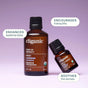 Two brown bottles of Cliganic Organic Lavender Essential Oil – Drop of Serenity on a purple background, with text bubbles reading: Enhances bedtime bliss, Encourages relaxation and tranquility, and Soothes the senses.
