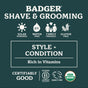 The Badger Balm Organic Hair Pomade Tin – Style & Shine label displays icons for solar powered, water free, family friendly, and gluten free. It highlights “Style + Condition” and is rich in vitamins. Certifications for cruelty free, USDA organic, and B Corp are showcased. This hair pomade offers medium hold and is crafted with organic beeswax for naturally effective styling.