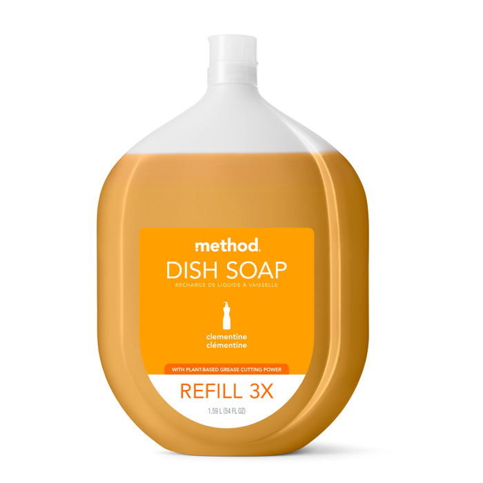 A large, clear bottle of method Dish Soap Starter Set - Clementine. The orange liquid shows through, and the label promotes its plant-based grease-cutting power as a 3x refill.