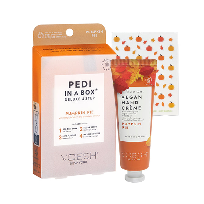 A boxed set labeled Pedi in a Box Deluxe 4 Step Pumpkin Pie, a tube of VOESH Vegan Hand Crème Pumpkin Pie, and a sheet of small pumpkin stickers, all with autumn-themed packaging.