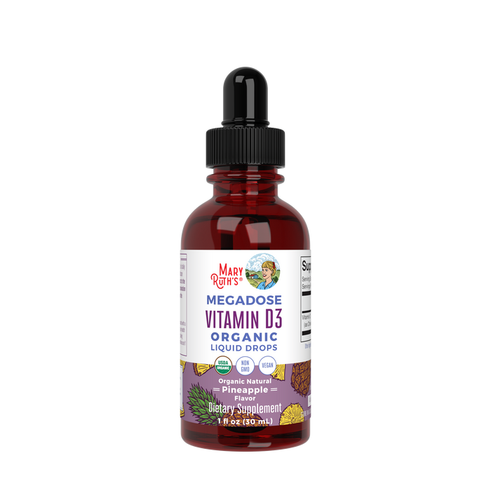 A brown glass bottle of MaryRuth’s Megadose Vitamin D3 Organic Liquid Drops, pineapple flavor, with a dropper cap and label showing supplement details and colorful fruit illustrations.