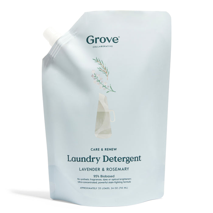A light blue refill pouch of Grove Collaborative Laundry Detergent, featuring lavender and rosemary scent. The packaging has a minimalist floral design and a white spout for pouring.