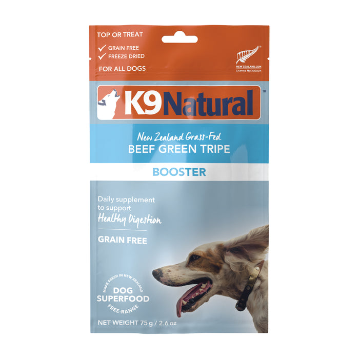 A bag of K9 Natural Beef Green Tripe Booster, a grain-free, freeze-dried dog supplement from New Zealand. The packaging features an image of a happy dog and product details.