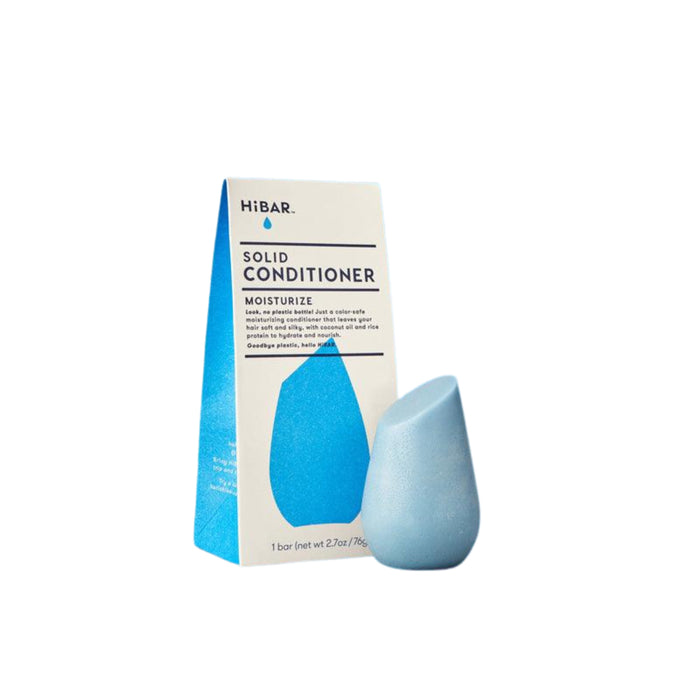 A blue, teardrop-shaped HiBAR solid conditioner is placed in front of its matching box packaging labeled Solid Conditioner Moisturize. The background is plain white.