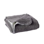 A folded, gray Cozy Cotton Organic Baby Blanket by Coyuchi featuring exposed edge stitching is displayed on a plain white background.
