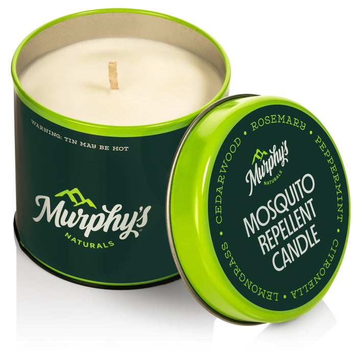 A green tin of Murphy’s Naturals Mosquito Repellent Candle with the lid leaning against the container. The lid lists ingredients: cedarwood, rosemary, peppermint, citronella, and lemongrass.