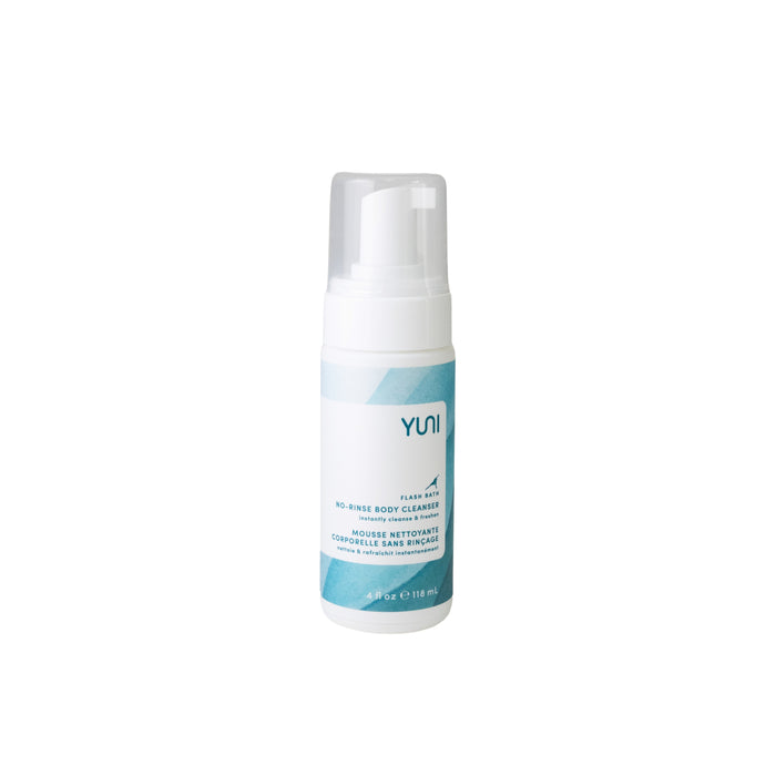 A white bottle of Yuni No-Rinse Body Cleanser with a blue label and a clear pump cap, standing upright on a plain white background.