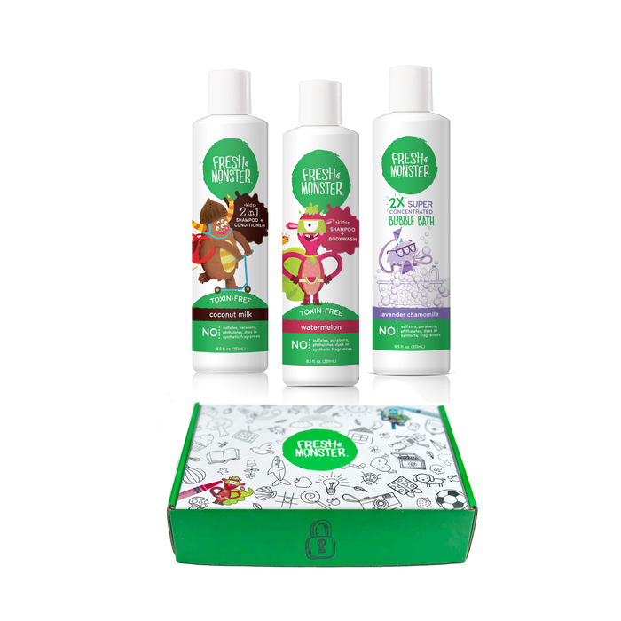 Three Fresh Monster bottles with playful monster illustrations are standing behind a green and white Fresh Monster box decorated with colorful cartoon monsters.