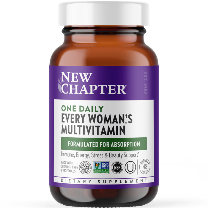 A brown bottle of New Chapter One Daily Every Womans Multivitamin with a purple and white label displaying various certifications and benefits, including immune, energy, stress, and beauty support.