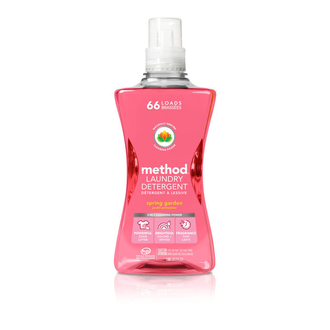 A pink bottle of method Laundry Detergent Pour in Spring Garden scent, featuring a clear cap, handles 66 loads with a fragrance boost. This vegan detergent uses plant-based ingredients for powerful cleaning and is part of cruelty-free products.