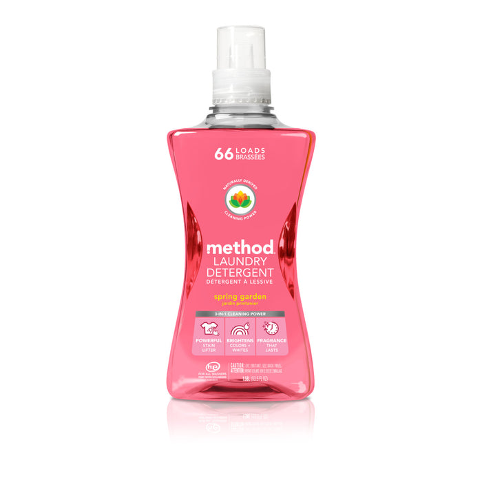 A pink bottle of method Laundry Detergent Pour in Spring Garden scent, featuring a clear cap, handles 66 loads with a fragrance boost. This vegan detergent uses plant-based ingredients for powerful cleaning and is part of cruelty-free products.