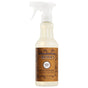 Mrs. Meyer's Multi-Surface Cleaner in Acorn Spice features a white spray nozzle and brown label with autumn leaves, combining essential oils for a refreshing clean on any surface.