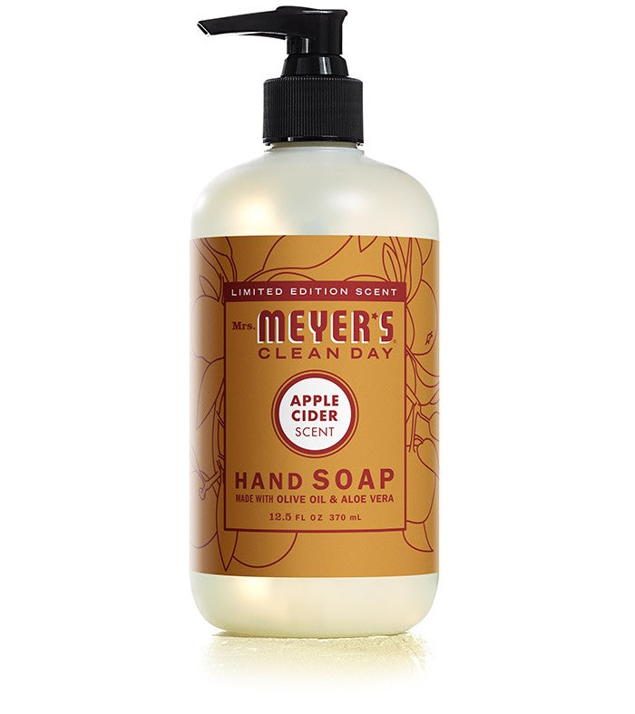 A limited edition 12.5 fl oz (370 ml) bottle of Mrs. Meyers Apple Cider Hand Soap features a pump dispenser, brown label, and contains olive oil and aloe vera.