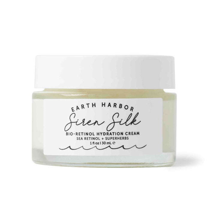 A clear glass jar of Earth Harbor Siren Silk Bio-Retinol Hydration Cream with a white lid and label, containing 1 fl oz (30 mL) of cream. The label mentions sea retinol and superherbs.