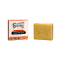 A yellow Spinster Sisters Co. Vegan Daily Glow Face Cleanser Bar - Pineapple and Papaya, ideal for acne-prone skin, sits next to its orange and white box displaying product details and branding.