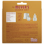Back of a Mrs. Meyer's Premium Scented Oil Diffuser Kit showing scented oil info, ingredients, warnings, contact details, and images of a wall plug-in diffuser and refill bottle with garden-inspired scents included inside.