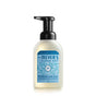 A bottle of Mrs. Meyer’s Clean Day Foaming Hand Soap in Rain Water scent, featuring a black pump top and a light blue label with bubble designs. The bottle contains 10 fl oz (296 mL) of soap.