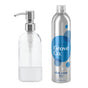 A transparent soap dispenser with a metal pump sits next to a silver Grove Co. Dish Soap Starter Set bottle labeled free & clear featuring a blue circle design. Both are set against a white background, presenting an eco-friendly option to reduce plastic waste.