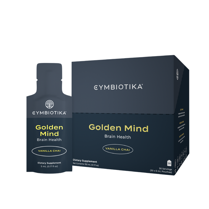 A box and single pouch of Cymbiotika Golden Mind Brain Health dietary supplement, vanilla chai flavor, displayed against a white background.