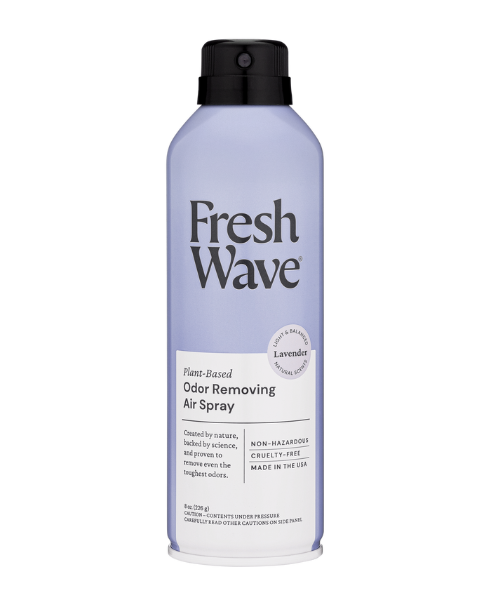 A light purple can of Fresh Wave Plant-Based Odor Removing Air Spray with a black cap. The label highlights lavender scent, non-hazardous, cruelty-free, and made in the USA.