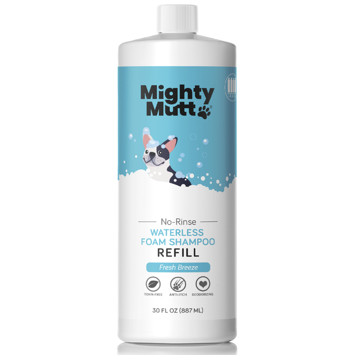 A white bottle of Mighty Mutt No-Rinse Waterless Foam Shampoo Refill with a cartoon dog, blue bubbles, and product features like toxin-free, anti-itch, and deodorizing. The bottle holds 30 fl oz (887 mL).