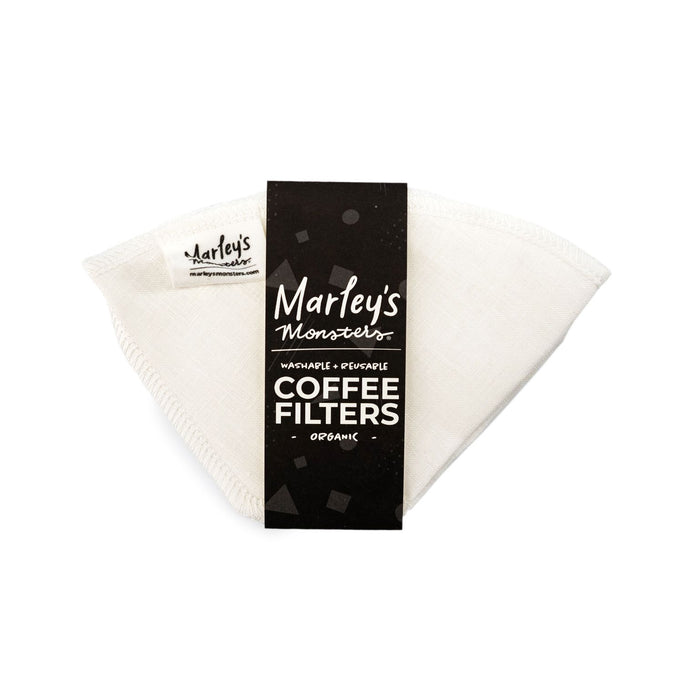 A reusable cloth coffee filter from Marleys Monsters is shown in its packaging, with a black label reading Marleys Monsters Washable + Reusable Coffee Filters Organic.