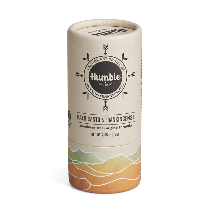A cylindrical tube of Humble brand deodorant in Palo Santo & Frankincense scent. The packaging is beige with a circular logo and wavy, colorful design at the bottom. The label states it is aluminum-free and 2.65 oz.