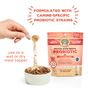 A person sprinkles Brutus Bone Broth probiotic powder onto a bowl of dog food. The product packaging highlights canine-specific probiotic strains and functional meal topper features. Text notes it's for adult dogs and contains human-grade ingredients.