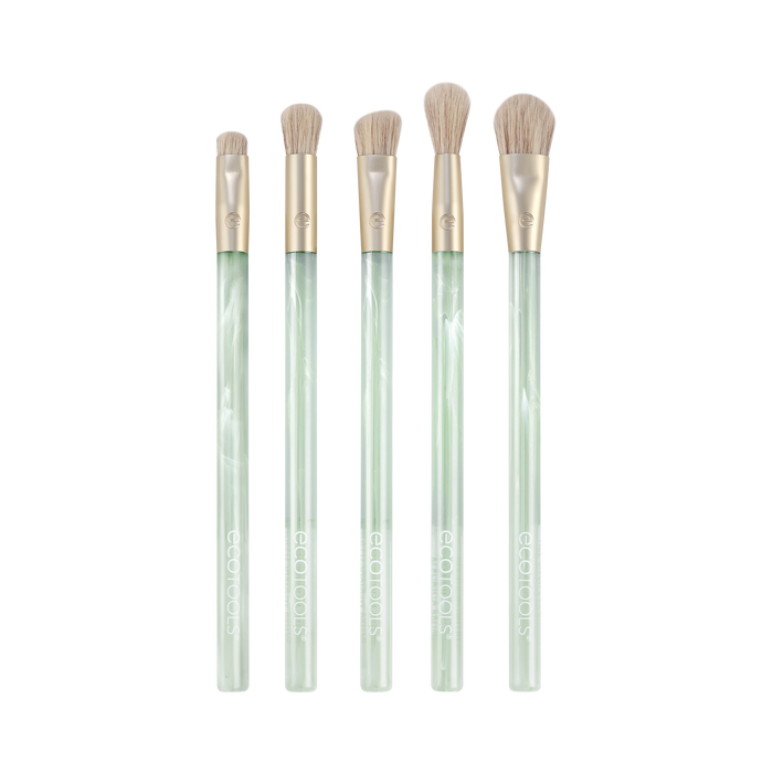 Five makeup brushes with light green marbled handles and gold ferrules, arranged upright in a row on a white background. The brush sizes and shapes vary, suitable for different makeup applications.