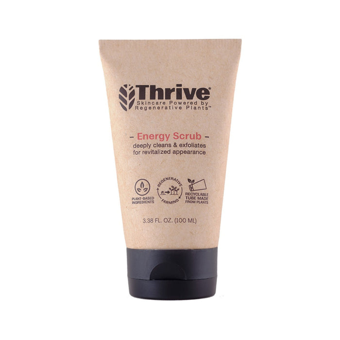 A tube of Thrive Energy Scrub with a tan label, black cap, and text highlighting plant-based ingredients, recyclable tube, and its exfoliating, revitalizing benefits. The tube contains 3.38 fl. oz. (100 ml).