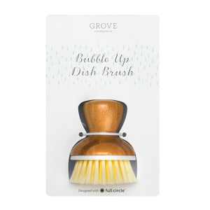 The Bubble Up Replacement Dish Brush by Grove Co. has a sturdy wooden handle and durable white bristles, paired with a Bubble Up base for stability. Designed with full circle text at the bottom highlights its eco-friendly commitment.