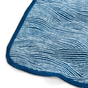 Close-up of Grove Co.s Reusable “Paper” Towels, featuring wavy blue and white organic cotton flannel stripes with a thick blue stitched border. Soft and slightly textured, the design flows gracefully while remaining machine-washable and durable.