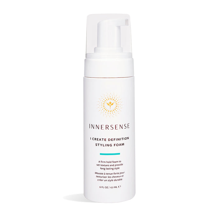 A white pump bottle of Innersense I Create Definition Styling Foam with gold design and text, designed for firm hold and long-lasting hair styling, 6 fl oz (177 mL) size, standing on a white background.